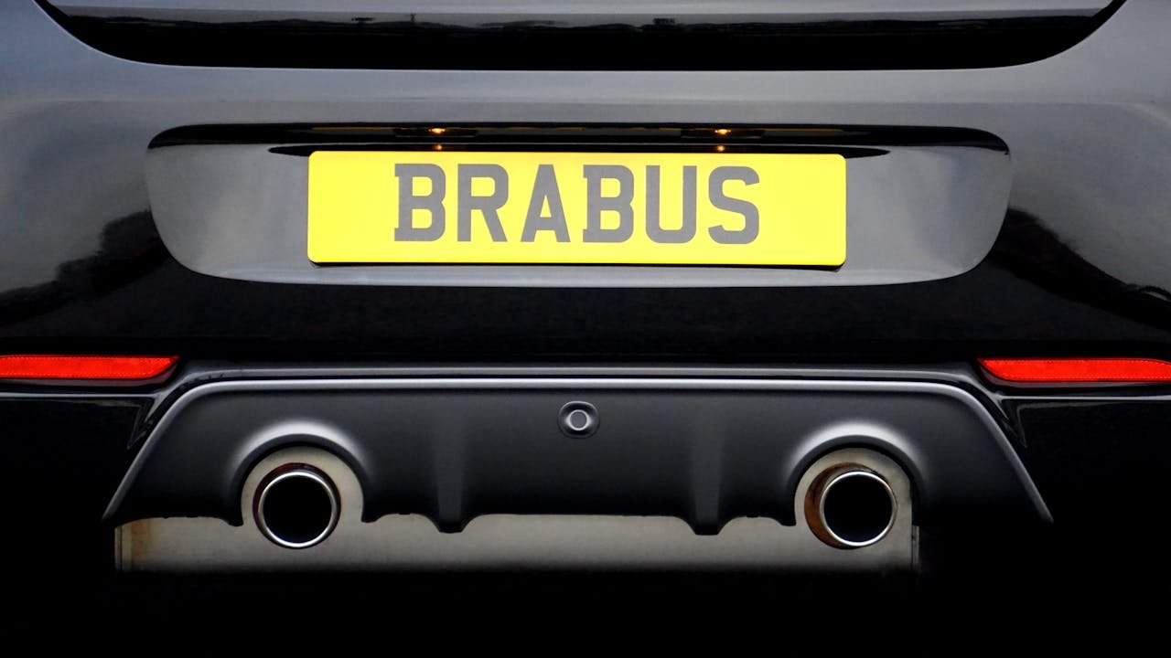 portfolio-02 Close-up of a Brabus car rear showcasing its exhaust and license plate.