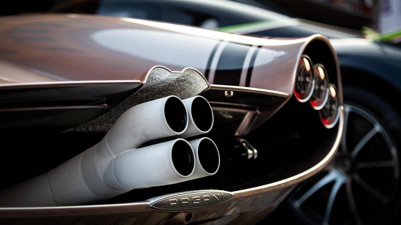 portfolio-04 Detailed view of Pagani hypercars exhaust pipes at car exhibition.